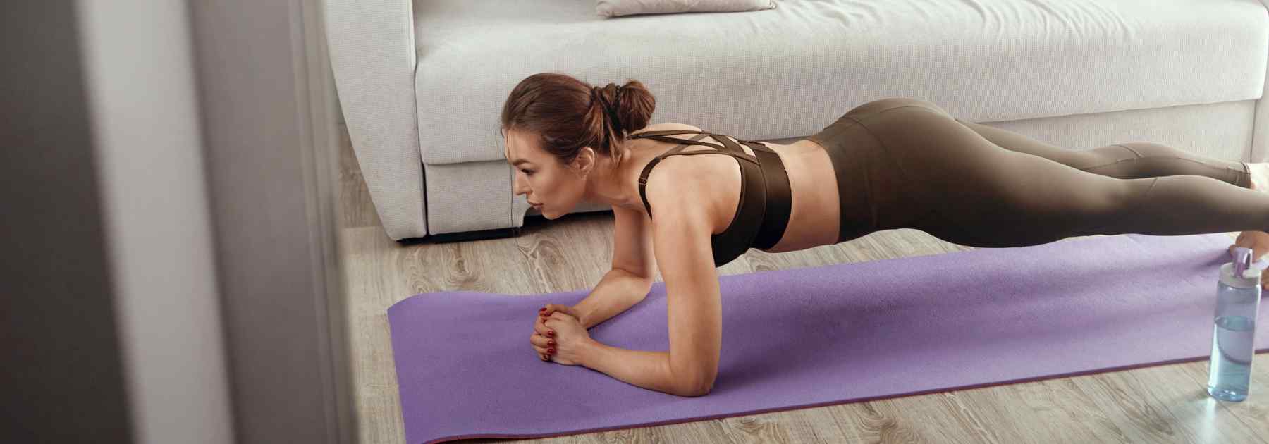 Woman maintaining weight loss motivation exercising